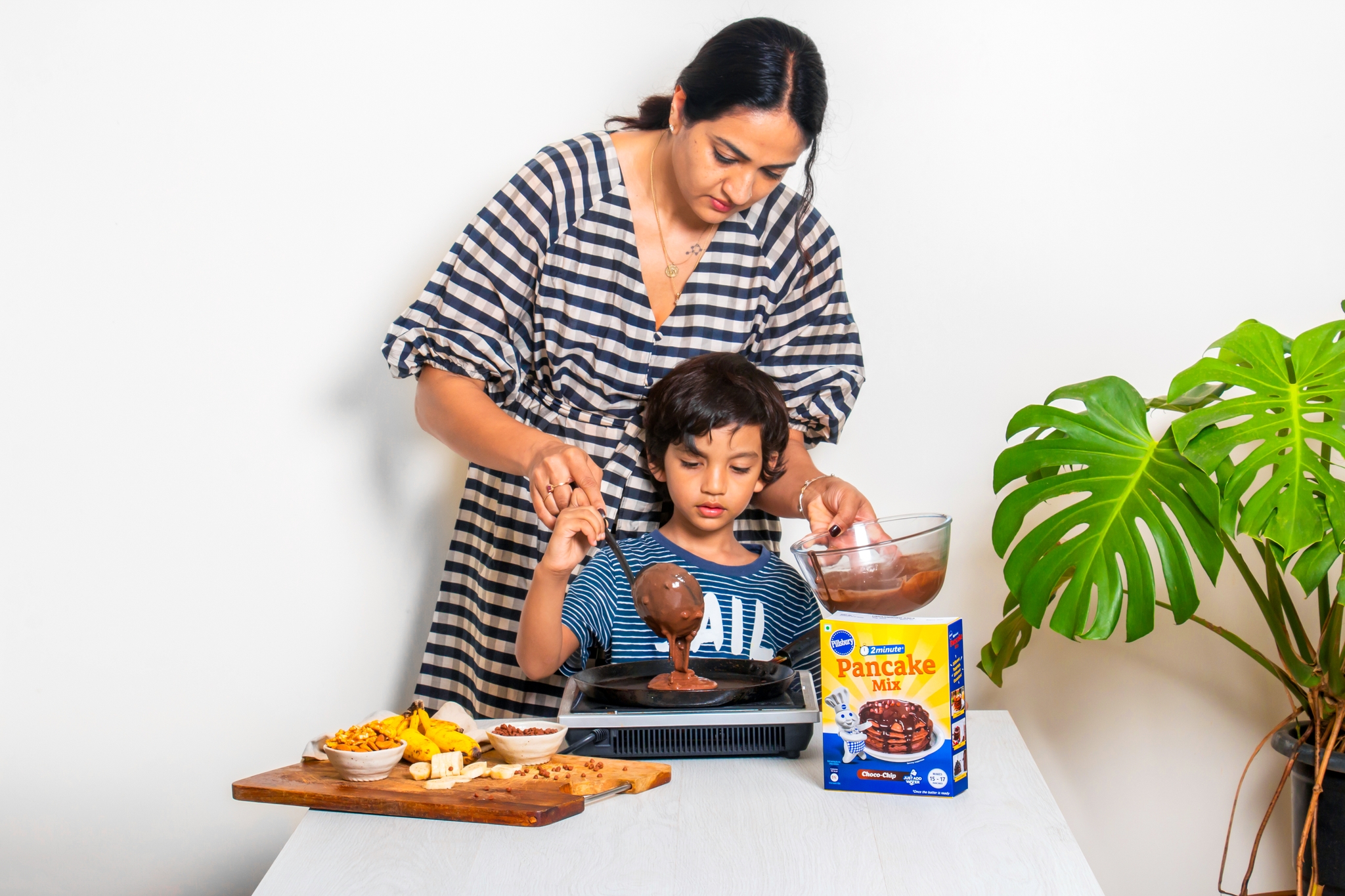 mom-helping-her-son-making-yummy-choco-food